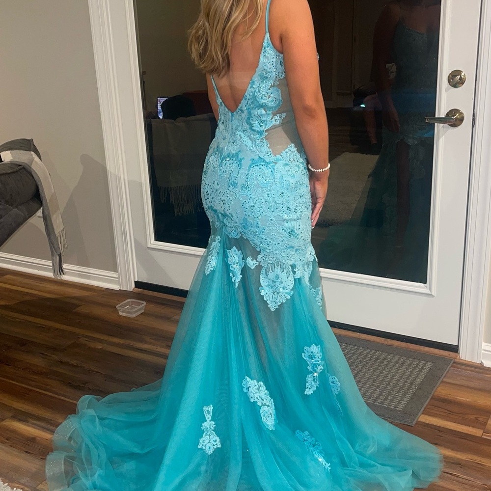Beautiful Turquoise prom dress. Lace and beaded with long train
